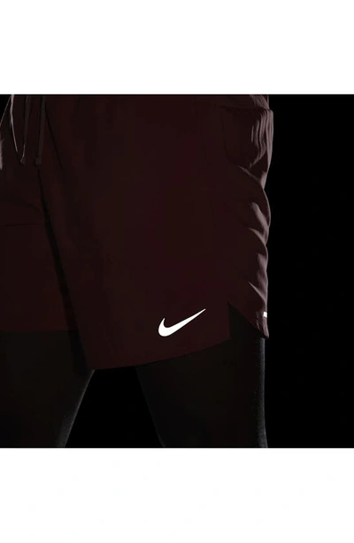 Shop Nike Dri-fit Stride 7-inch Brief-lined Running Shorts In Adobe/ Red Stardust