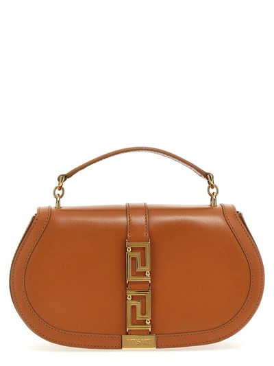 Shop Versace 'greca' Handbag In Beige