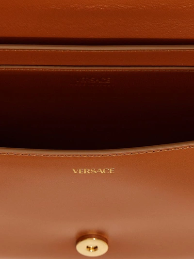 Shop Versace 'greca' Handbag In Beige
