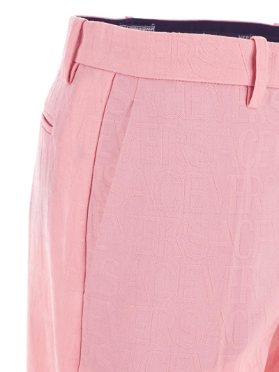 Shop Versace Flared Trousers In Pink