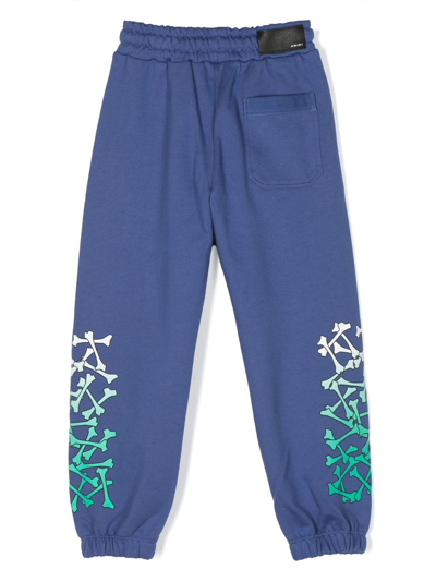 Shop Amiri Bones-print Drawstring Cotton Track Pants In Blue