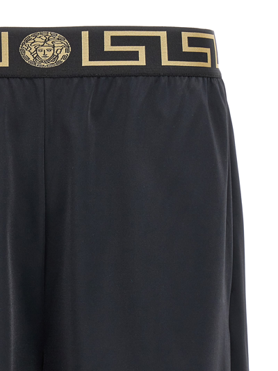 Shop Versace Greca Bermuda Shorts In Black