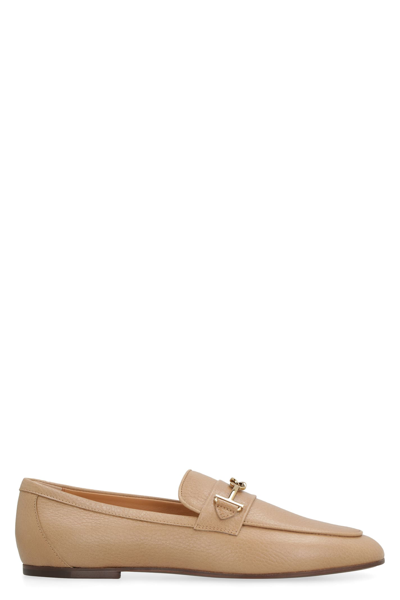 Shop Tod's Pebbled Leather Loafers In Beige