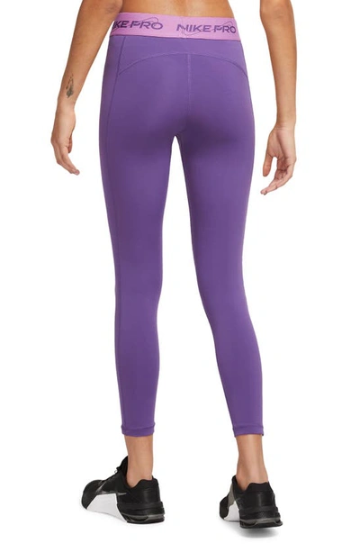 Shop Nike Pro Dri-fit Mid-rise 7/8 Leggings In Purple Cosmos/ Rush Fuchsia