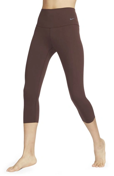 Shop Nike Zenvy Gentle Support High Waist Crop Leggings In Earth/black