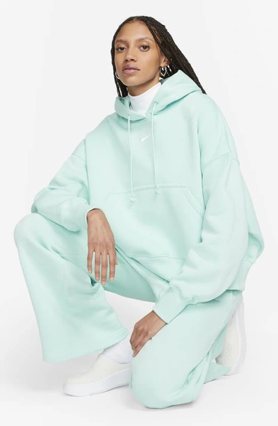 Shop Nike Sportswear Phoenix Fleece Pullover Hoodie In Jade Ice/sail