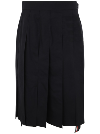 Shop Thom Browne Below Knee Dropped Back Pleated Skirt In Engineered 4 Bar Plain Weave Suiting In Dark Blue