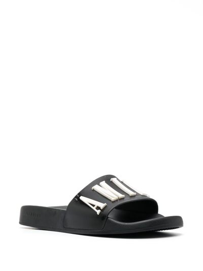 Shop Amiri Logo-embossed Faux-leather Slides In Black