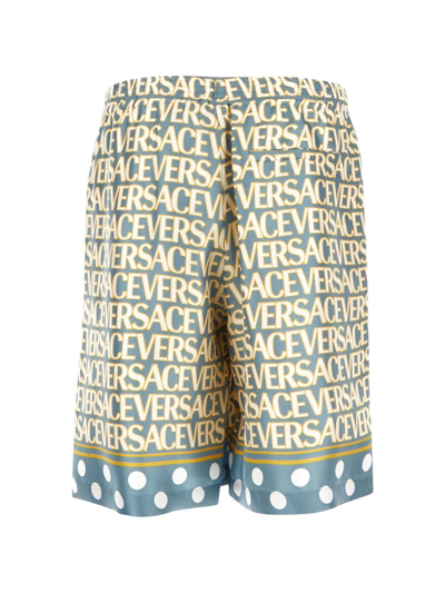 Shop Versace All-over Logo Shorts In Blue