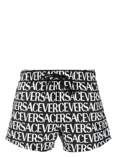 Shop Versace Logo-print Swim Shorts In Nero E Bianco