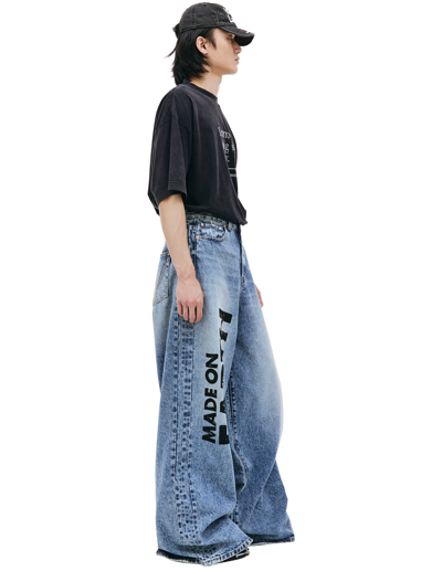 Shop Vetements 'made On Earth' Printed Jeans In Blue