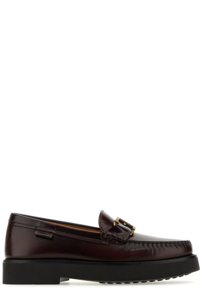 Shop Tod's Logo Plaque Round Toe Loafers In Brown