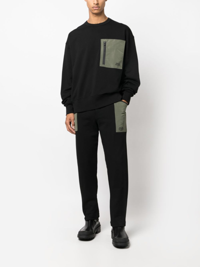 Alexander Mcqueen Contrast-pocket Cotton Track Pants In Schwarz