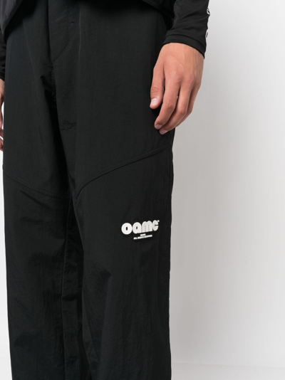 Shop Oamc Logo-patch Track Pants In Schwarz