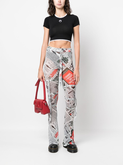 Shop Charles Jeffrey Loverboy Newspaper-print Skinny Trousers In Black