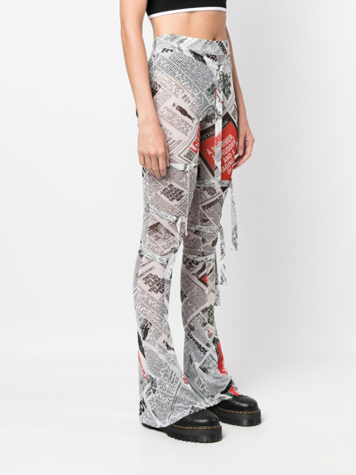 Shop Charles Jeffrey Loverboy Newspaper-print Skinny Trousers In Black