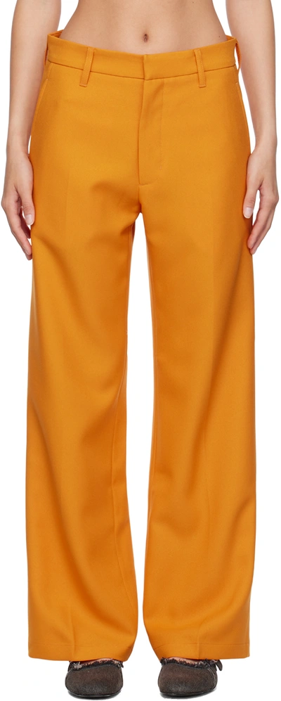 Shop Stockholm Surfboard Club Orange Bootcut Trousers In Carrot