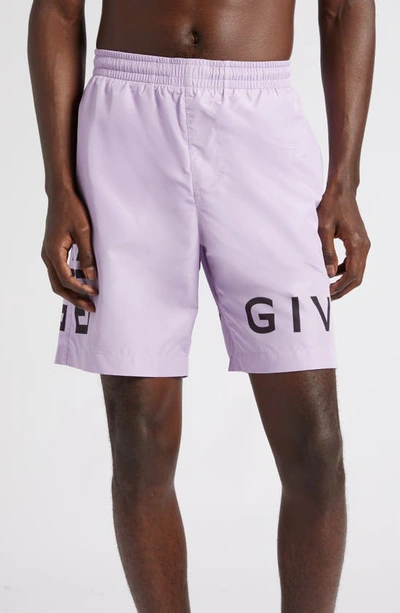 Shop Givenchy Logo Swim Trunks In 540-lilac