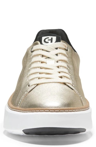 Shop Cole Haan Grandpro Topspin Sneaker In Gold/ Black