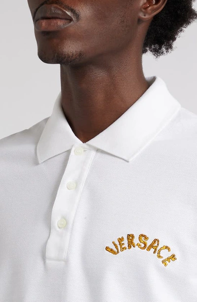 Shop Versace Seashell Baroque Logo Cotton Piqué Polo In 1w000-optical White