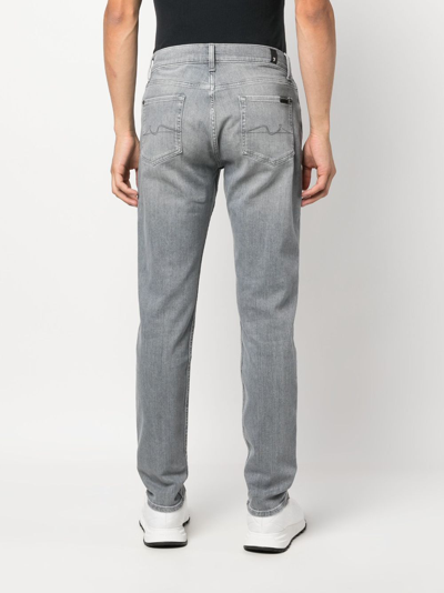 Shop 7 For All Mankind Skinny Tapered Jeans In Grey
