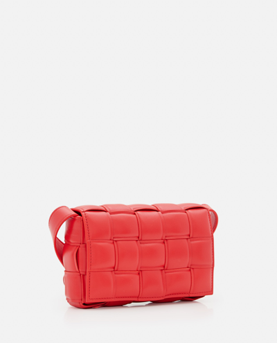 Shop Bottega Veneta Small Padded Cassette Leather Crossbody Bag In Red