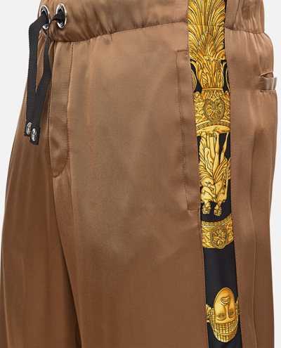 Shop Versace Pants In Golden