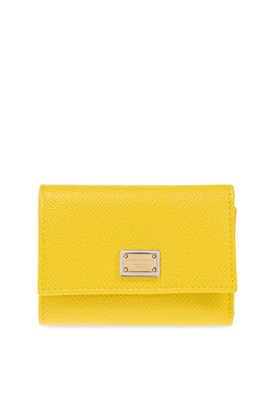Shop Dolce & Gabbana Logo Plaque Trifold Wallet In Yellow