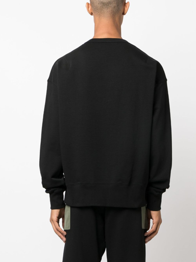 Shop Alexander Mcqueen Contrasting Pocket Crew Neck Sweatshirt In Black