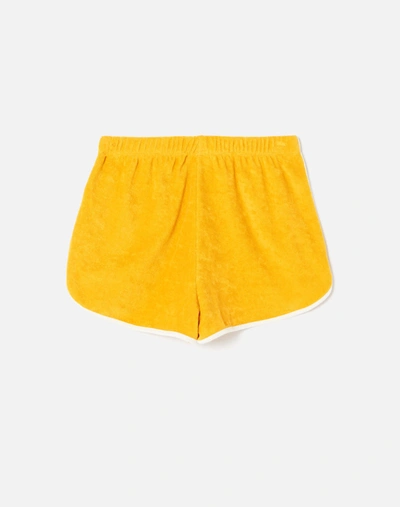 Shop Re/done 90s Terry Cloth Short In Marigold