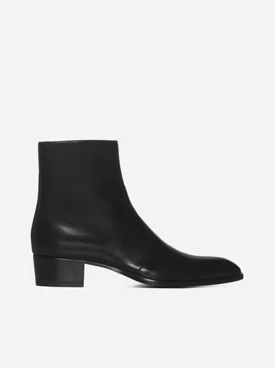 Shop Saint Laurent Wyatt Leather Ankle Boots In Black
