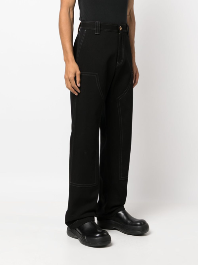 Shop Versace Wide-leg Cotton Trousers In Black
