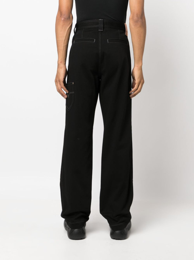 Shop Versace Wide-leg Cotton Trousers In Black
