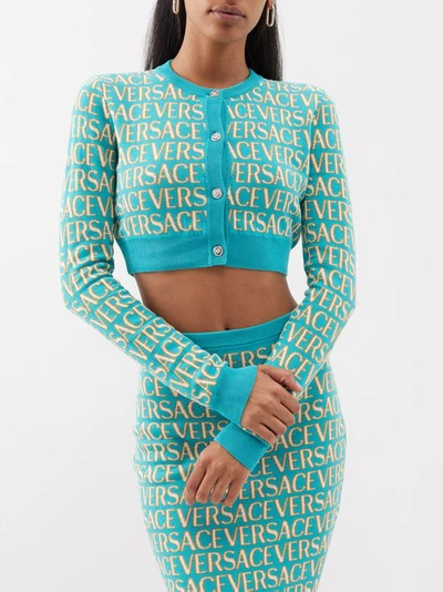 Shop Versace Cropped Logo-jacquard Cotton-blend Cardigan In Turquoise
