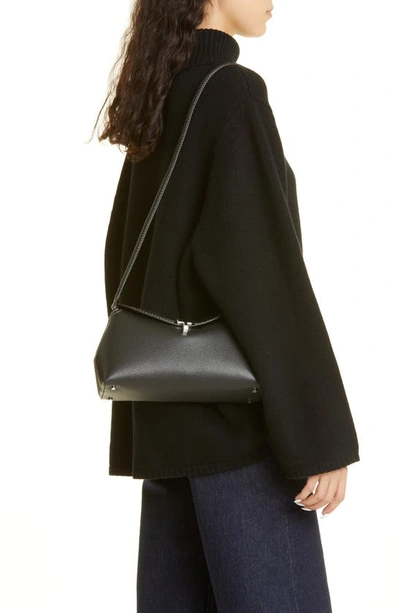 Shop Totême T-lock Leather Clutch In Black Grain