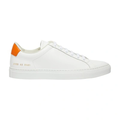 Shop Common Projects Rétro Low Top Sneakers In White_orange