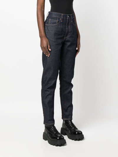 Shop Levi's Mid-rise Tapered-leg Jeans In Blue