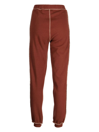 Shop Baserange Exposed-seam Fine-ribbed Track Pants In Red