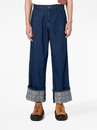 Shop Jw Anderson Grid-print Wide-leg Jeans In Blue