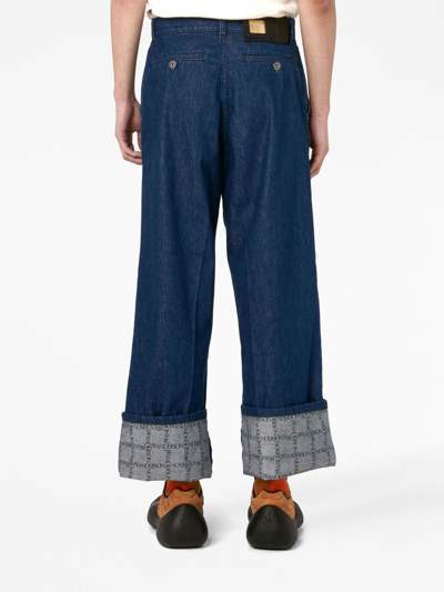 Shop Jw Anderson Grid-print Wide-leg Jeans In Blue