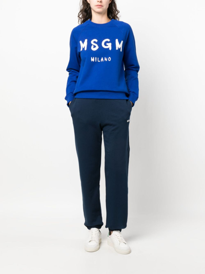 Shop Msgm Logo-print Cotton Track Pants In Blue