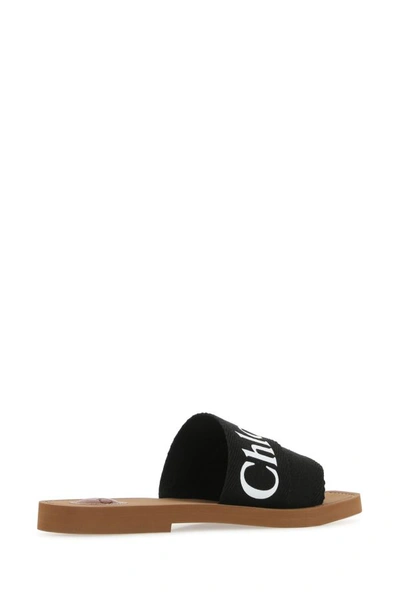 Chloé Woody Flat Logo Ribbon Slide Sandals In Black