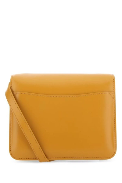 Chloé Versatile Leather Clutch With Unique Front Handle In Yellow