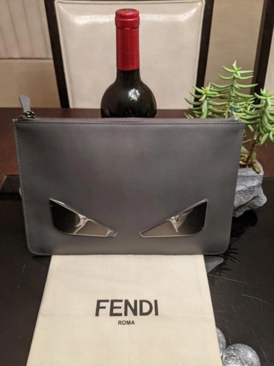 Shop Fendi Women Monster W/ Metallic Eyes Black Leather Clutch In Gray