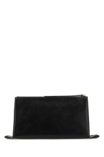 Jil Sander Logo Embossed Zipped Clutch Bag In Black