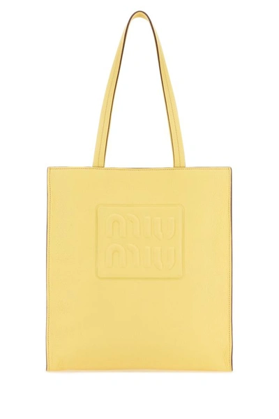 Shop Miu Miu Woman Pastel Yellow Leather Shopping Bag
