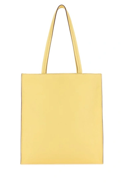 Shop Miu Miu Woman Pastel Yellow Leather Shopping Bag