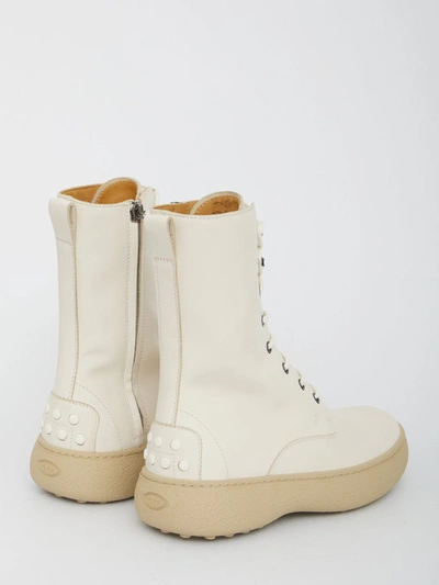 Shop Tod's Winter Gommini Ankle Boots In Cream