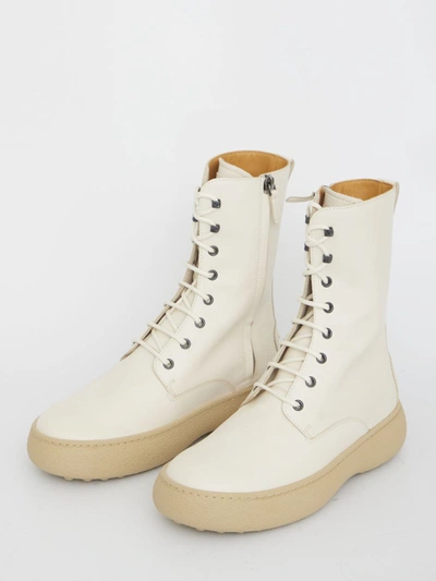 Shop Tod's Winter Gommini Ankle Boots In Cream