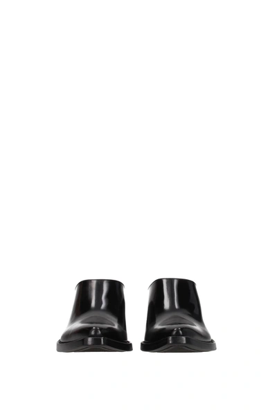 Shop Prada Slippers And Clogs Leather Black